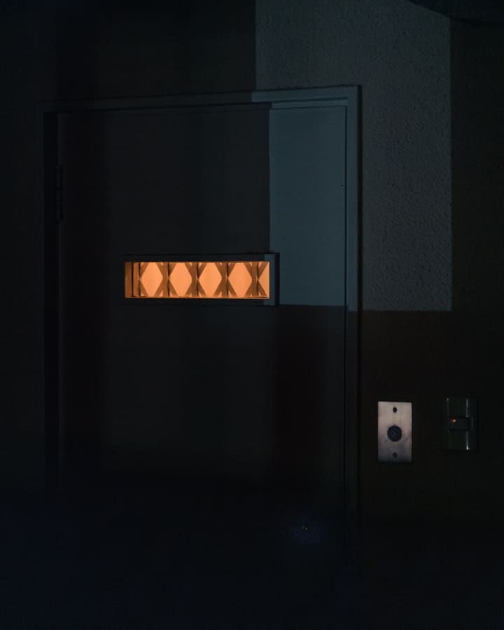 glass door with glowing orange pattern