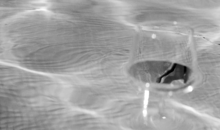 wine glass floating in pool