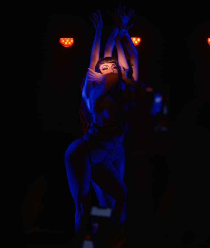 dancer under blue stage light