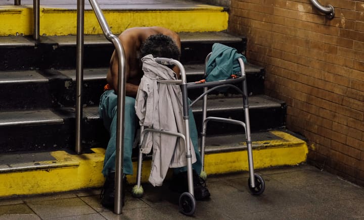 homeless man on subway stairs