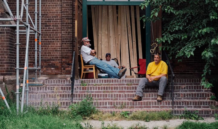 two men on brick steps, renovation