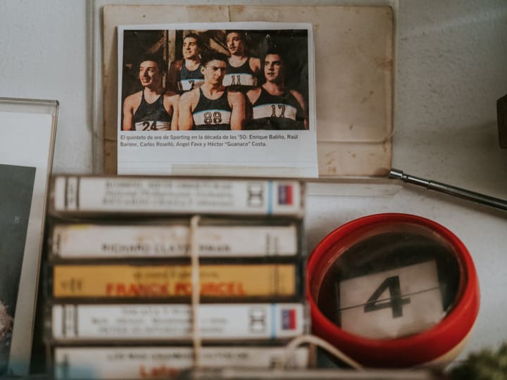 shelf with team photo and cassettes