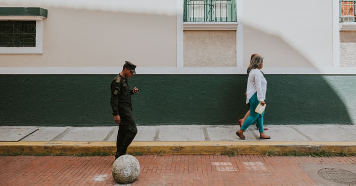 soldier walking, woman on sidewalk