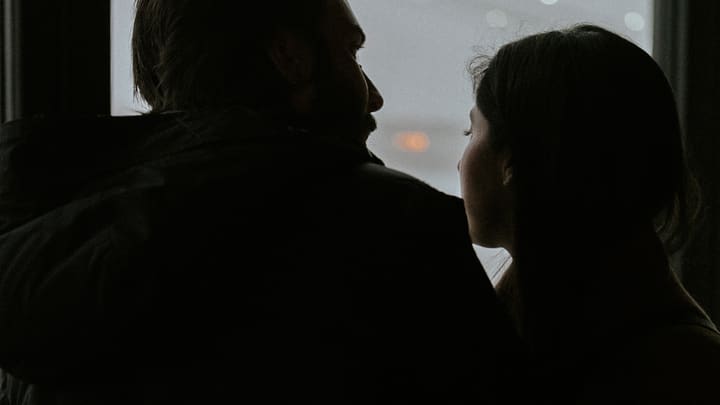 couple silhouette by hazy window