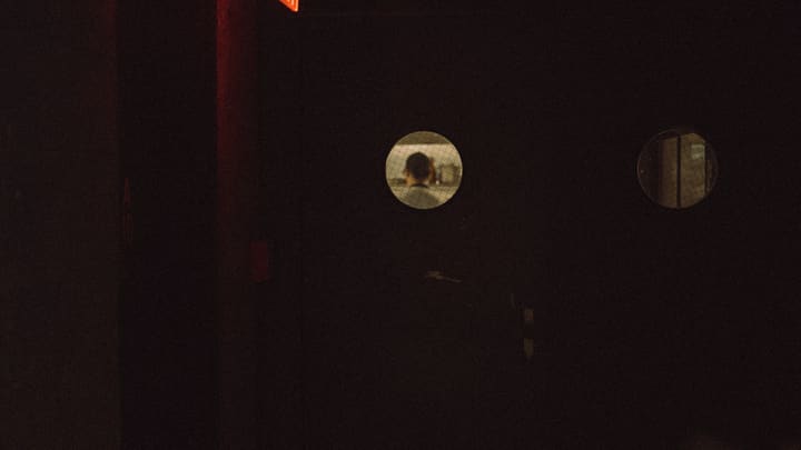 glowing round windows in darkness