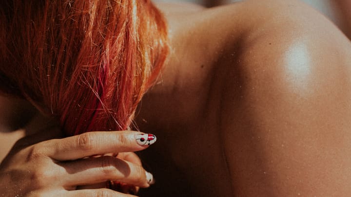 close-up shoulder and red hair
