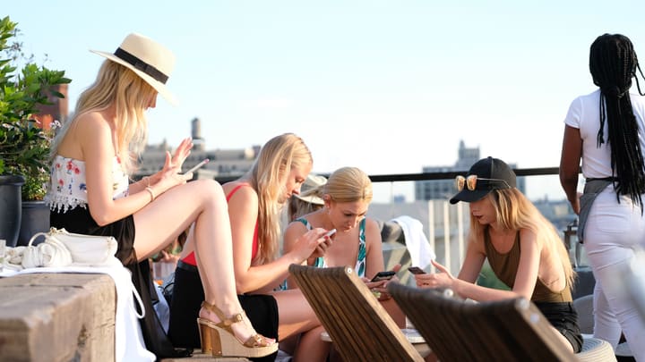 women on rooftop terrace
