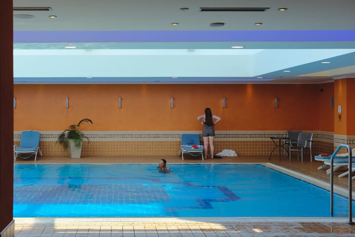 indoor pool with orange walls