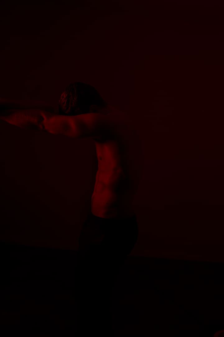 red-lit nude figure study